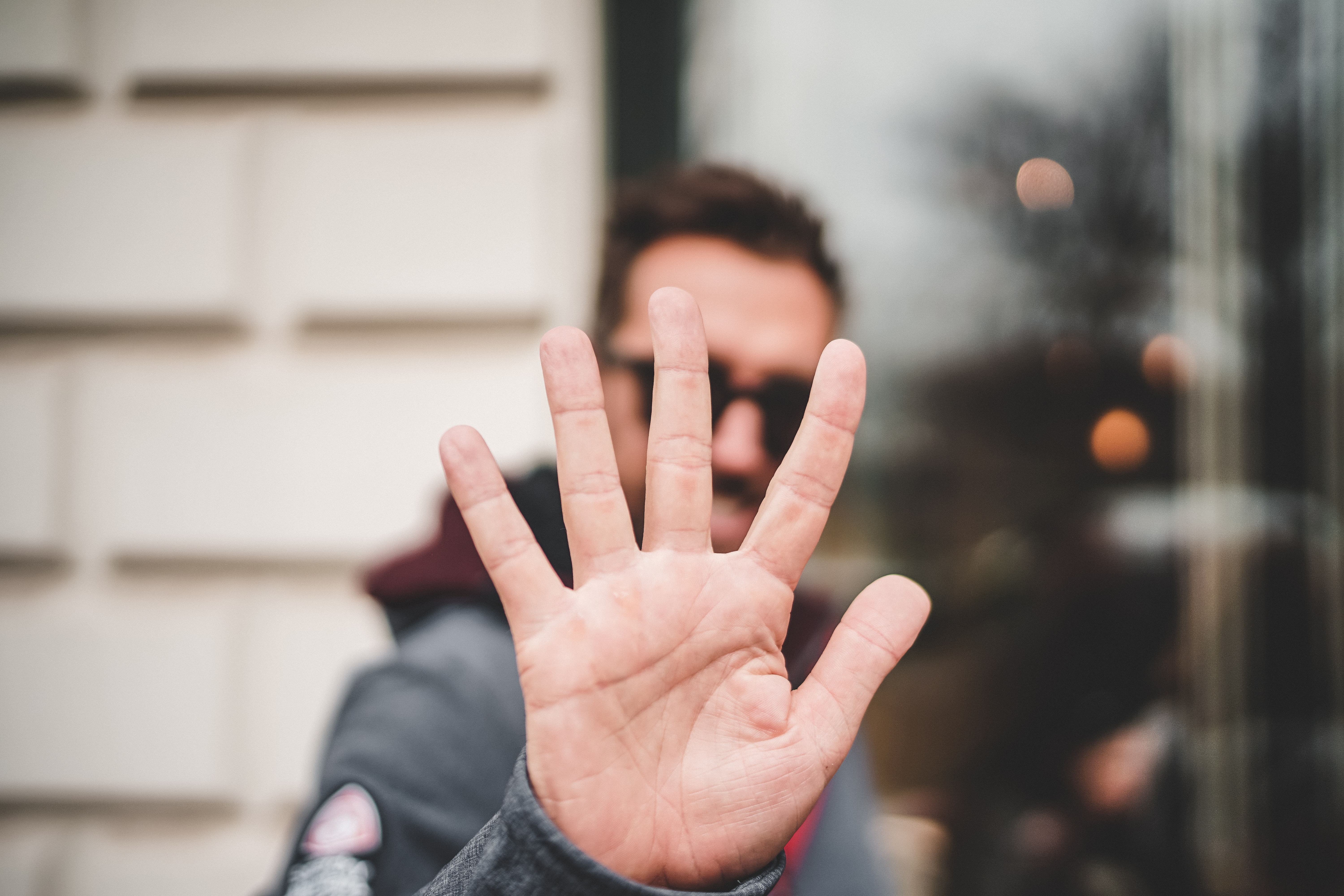 Man raising his hand, symbolizing 5 Ways to Fundraise